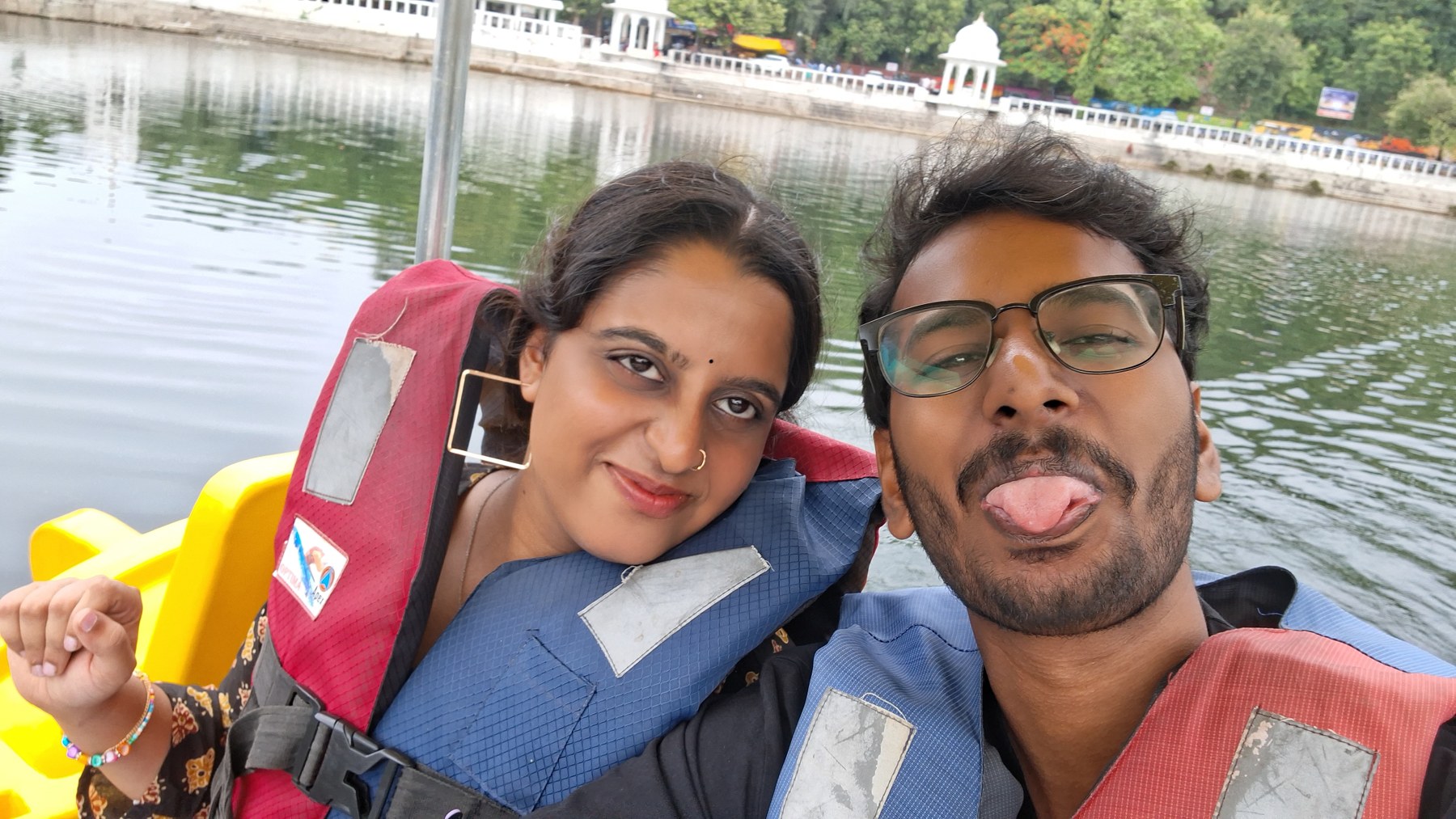 Lenal and Bhavna making playful faces on their boat ride